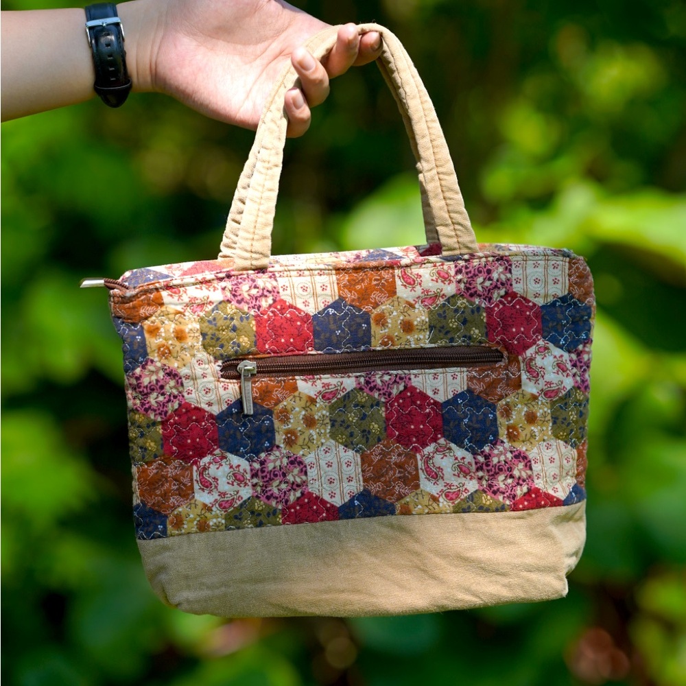 A vintage fabric bag with a patterned design